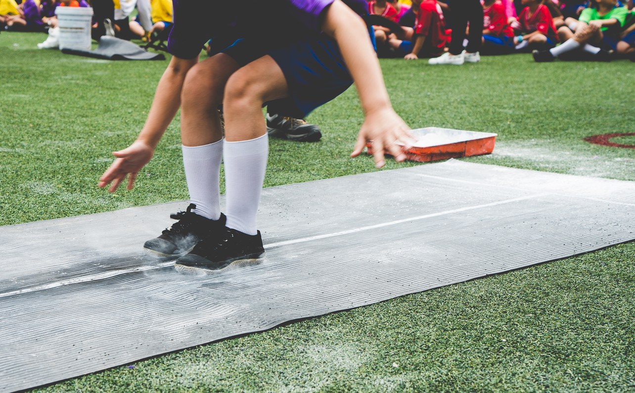 Athlete completing a long jump